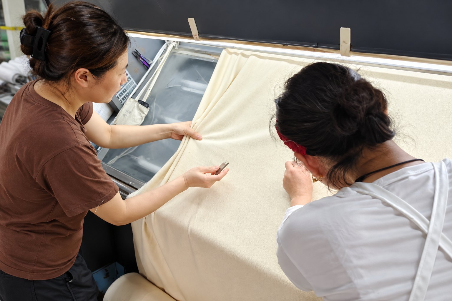 Fabric being examined during textile quality control in China