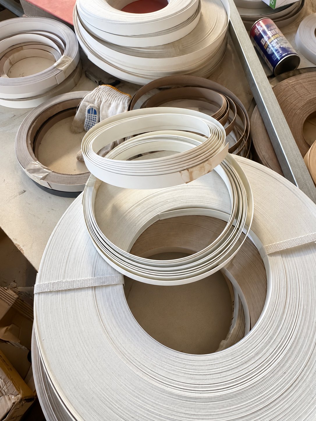 Rolls of edge-banding material used in furniture component production